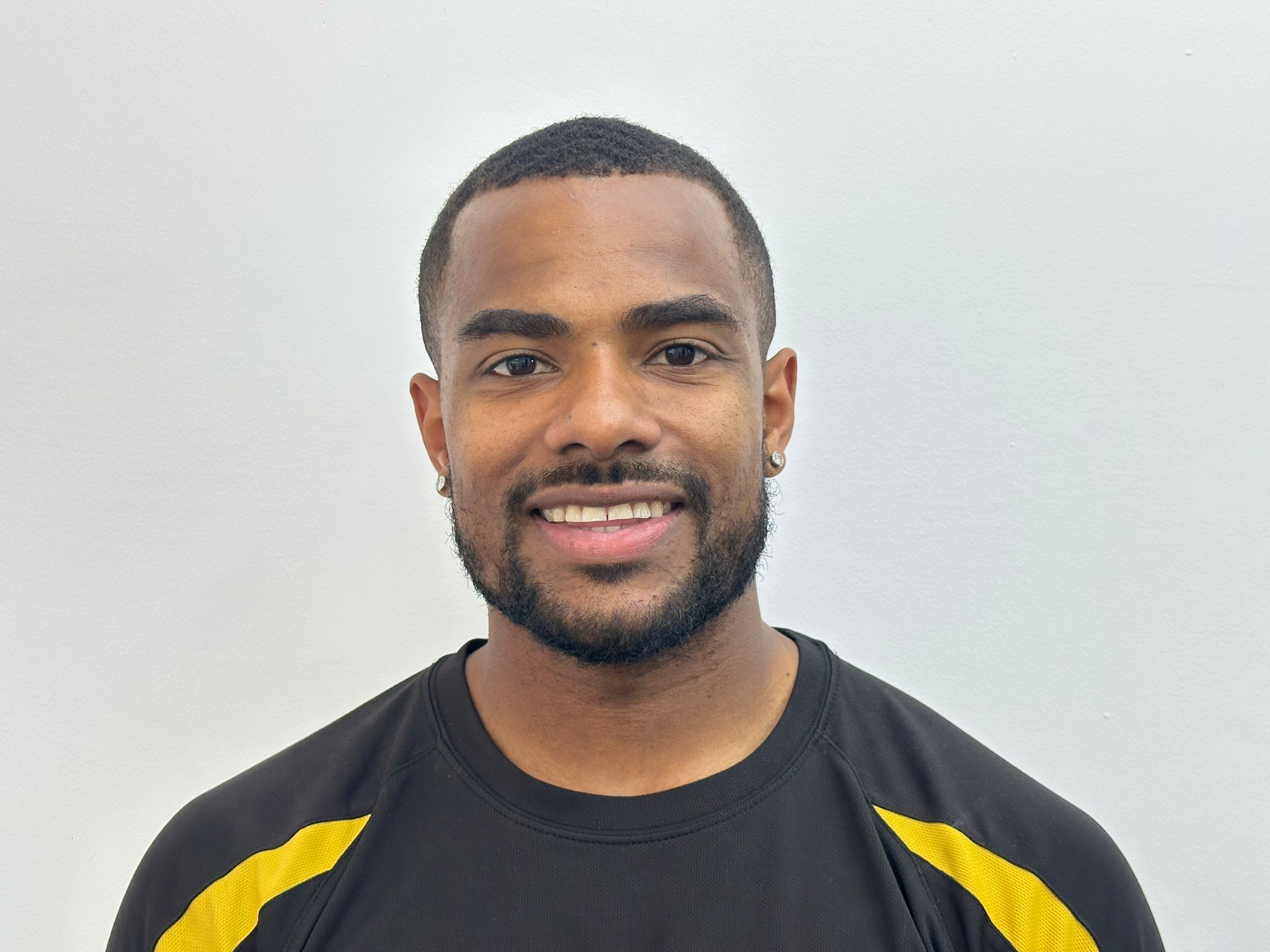 Liam Dinnall-Bateman working with an athlete